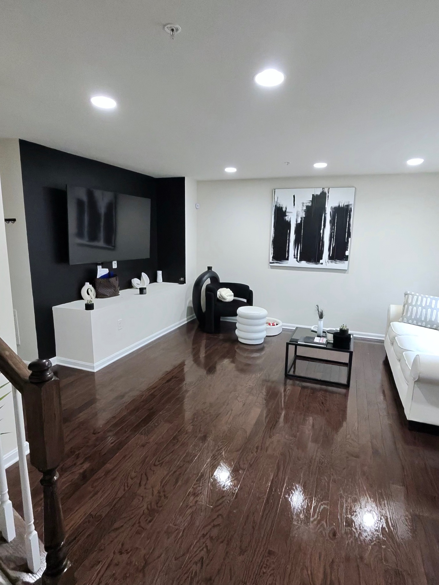Spotless living room with gleaming hardwood floors after a T&T Affordable Cleaning Service visit